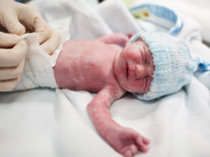 Newborn baby to illustrate the possibility of preterm birth in high-risk pregnancy