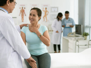 woman discussing potential side effects of hormone pellet therapy with a doctor