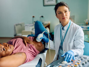 female doctor examining a patient to illustrate PCOS and pregnancy