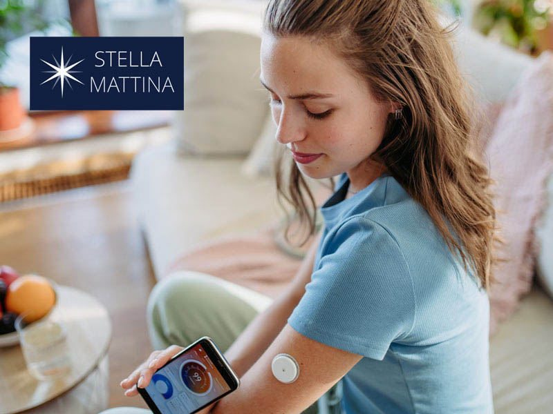 young woman with a continuous glucose monitor to illustrate helping to reverse type 2 diabetes