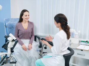 Young woman consulting with gynecologist to illustrate preparing for a healthy pregnancy