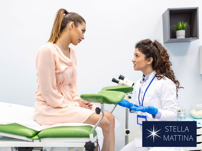 gynecologist talking with young woman to illustrate explaining about cervical cancer screening