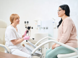 Gynecologist talking with patient to illustrate discussing cervical screening results