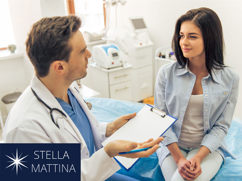 Woman consulting with doctor to illustrate how we support expecting mothers
