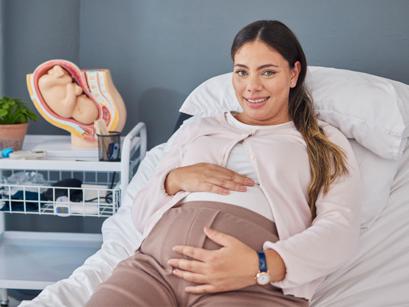 pregnant woman in clinic to check for preeclampsia first symptoms