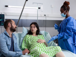 young parents expecting a child to illustrate how recognizing preeclampsia first symptoms can save lives