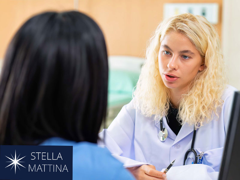 Doctor discussing with a patient to illustrate possible HIV diagnosis and if it shows up in routine blood tests
