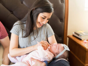 Mother gazing at healthy child to illustrate long-term benefits for breastfed children