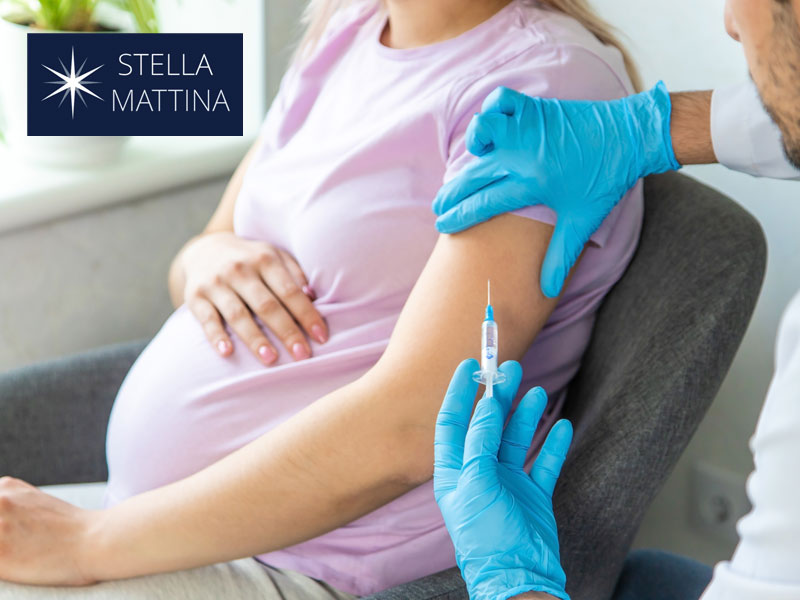 Nurse giving a shot to illustrate a woman receiving vaccines in pregnancy