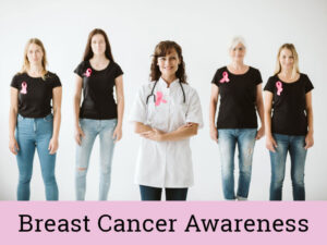 Young doctor and patients wearing pink ribbons to show breast cancer awareness