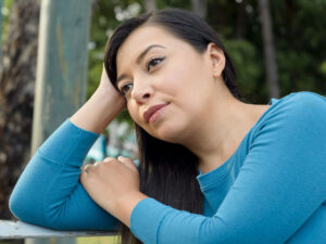 woman looking bored or exhausted to illustrate signs you have a hormone imbalance affecting weight loss